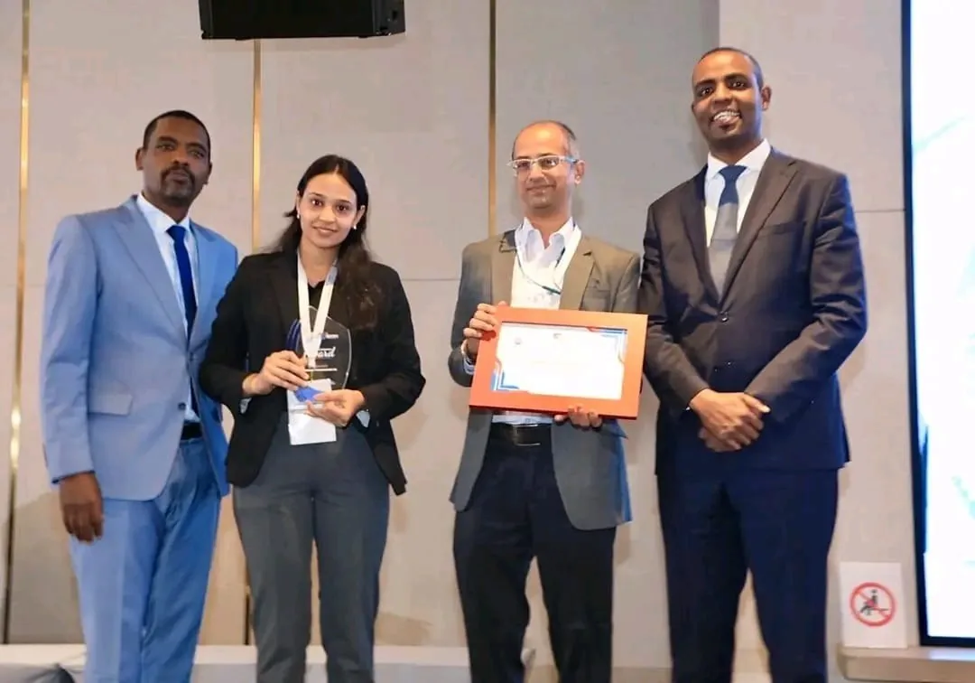 Suppliers receiving a framed certificate and a glass award during the performance recognition ceremony at the EPSS conference