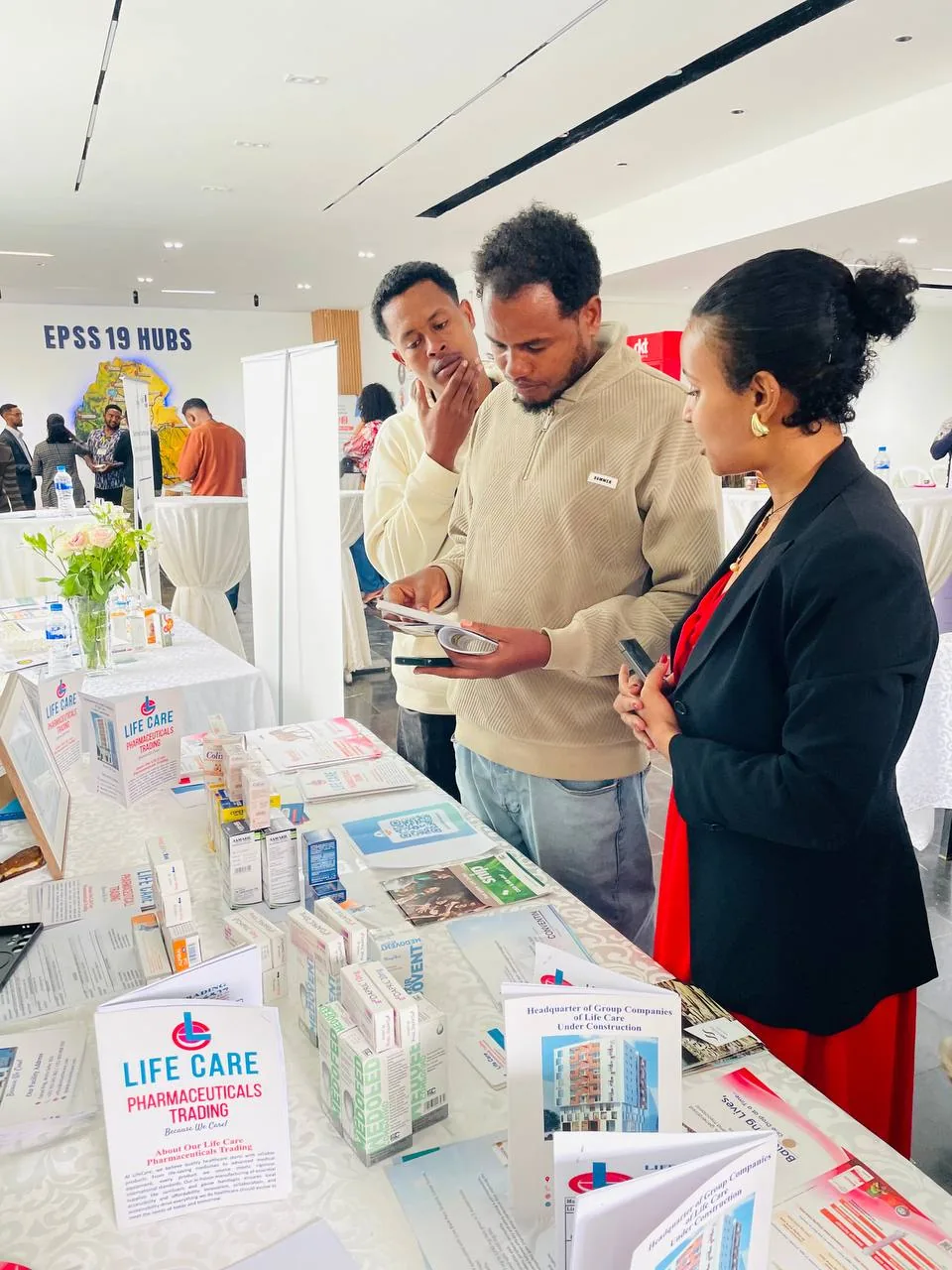 Delegates reviewing LifeCare product literature Conference delegates reviewing LifeCare product literature and pharmaceutical samples on the exhibition table